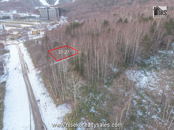 AzaIzumikawa37-27 with Rusutsu Ski Resort west mountain, Vale Rusutsu, in the background.